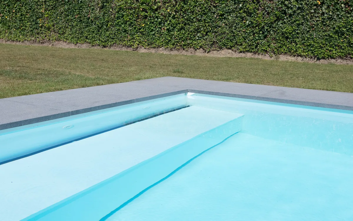 Built-in pool bench in residential pool