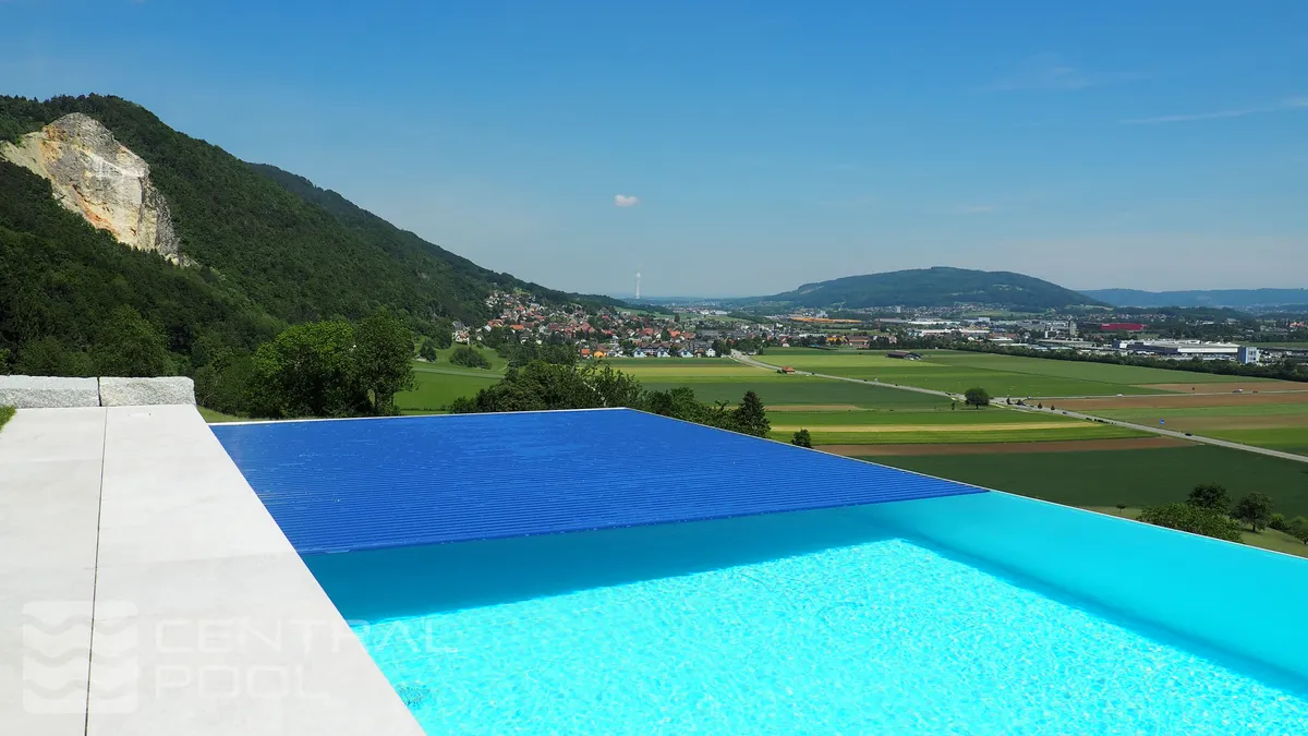 Roll cover in open position over pool