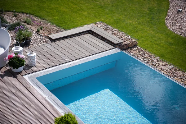 Pool with dark roll cover deployed